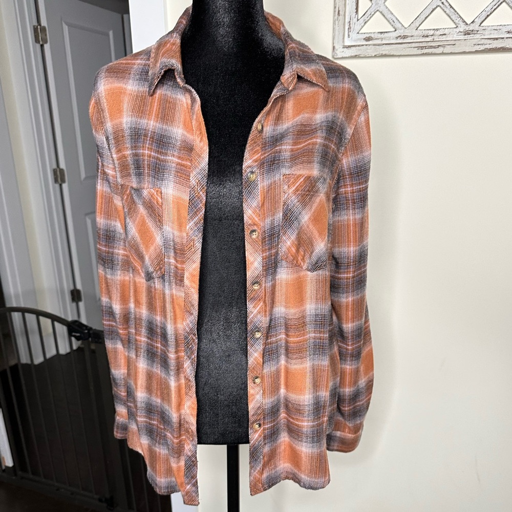 Plaid button down shirt.